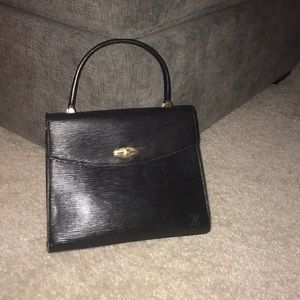 Woman's Louis Vuitton purse